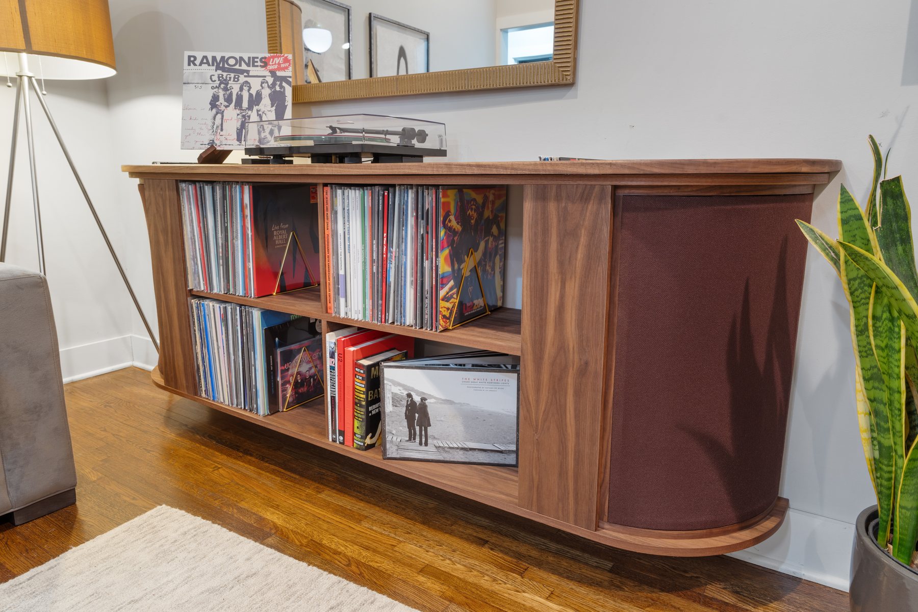 Record console with vinyl collection and turntable